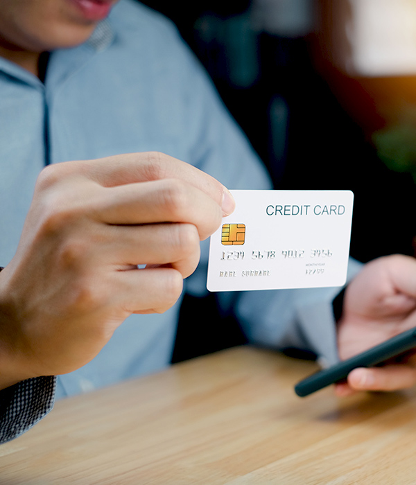 man paying with a credit card