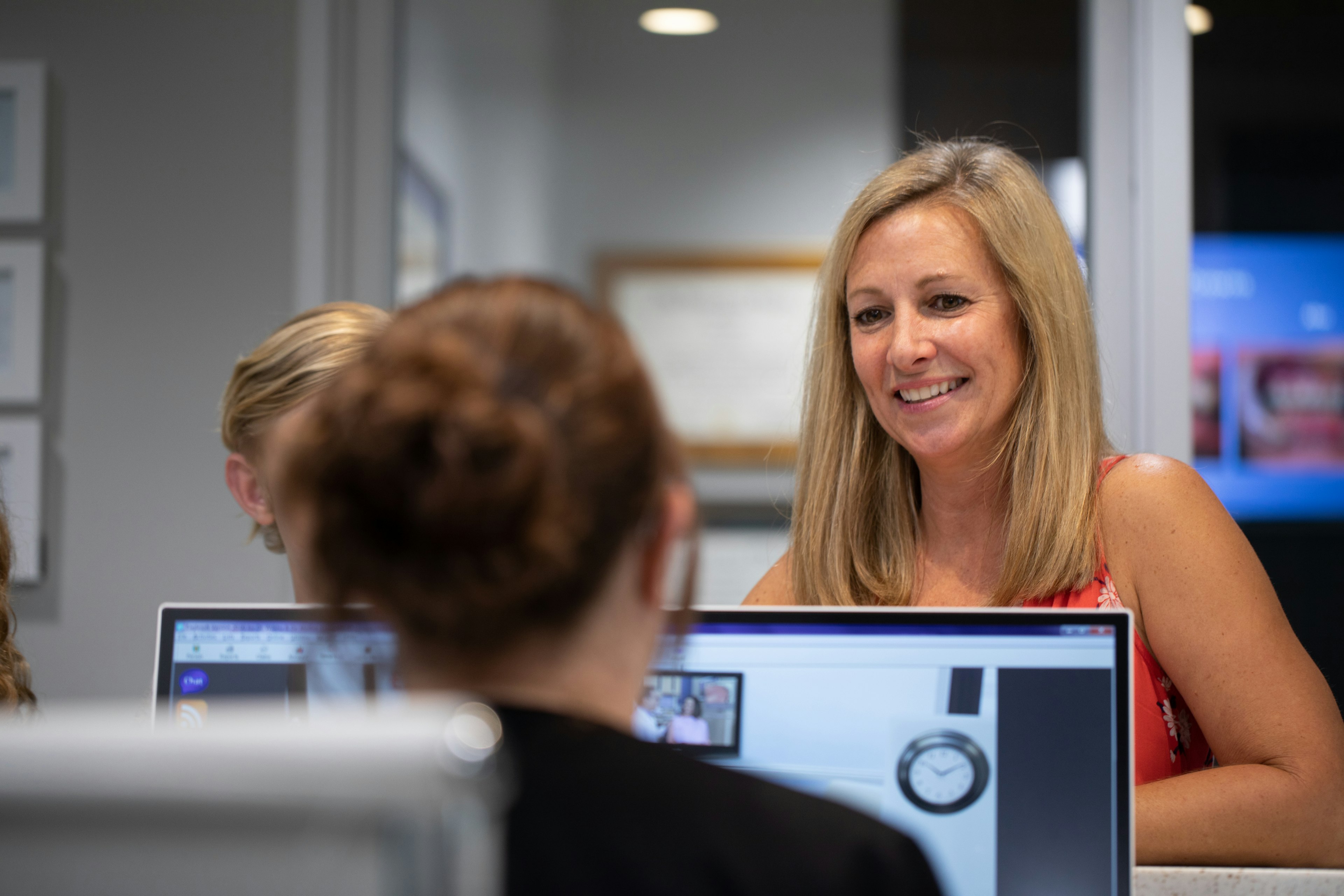 Secretary helping patient with financial assistance