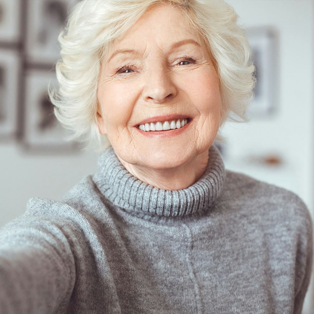 Smiling mature woman taking a selfie