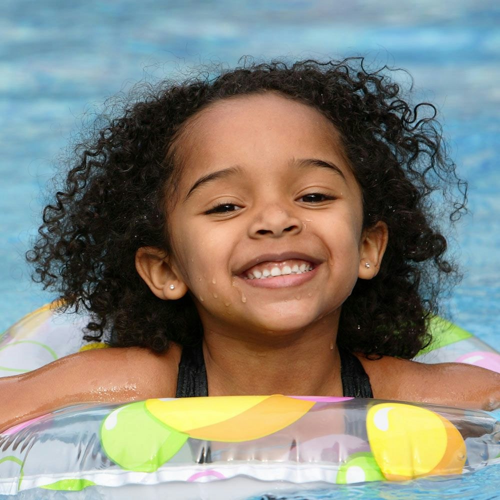Smiling girl at the pool