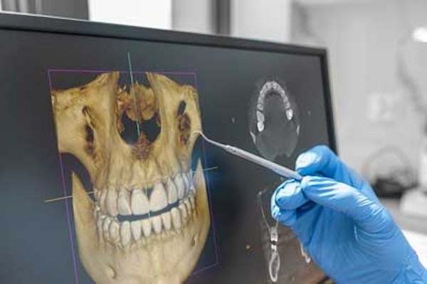 Dentist examining imaging