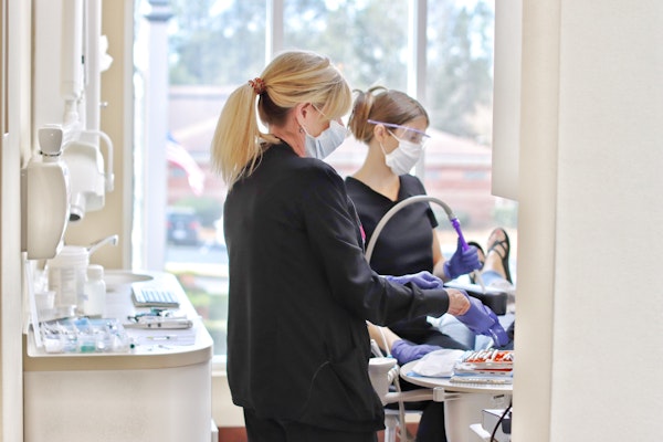 Dental staff looking at teeth