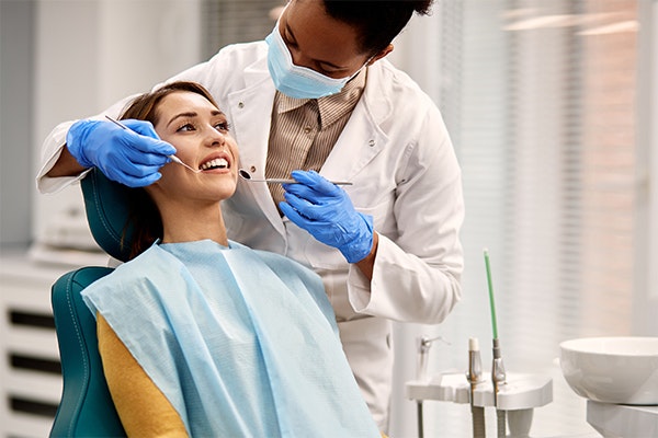 Dentist treating a root canal patient