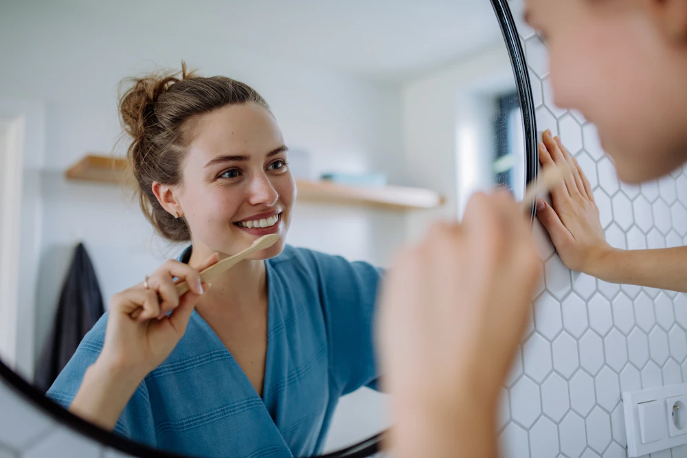 woman smiling in the mirror
