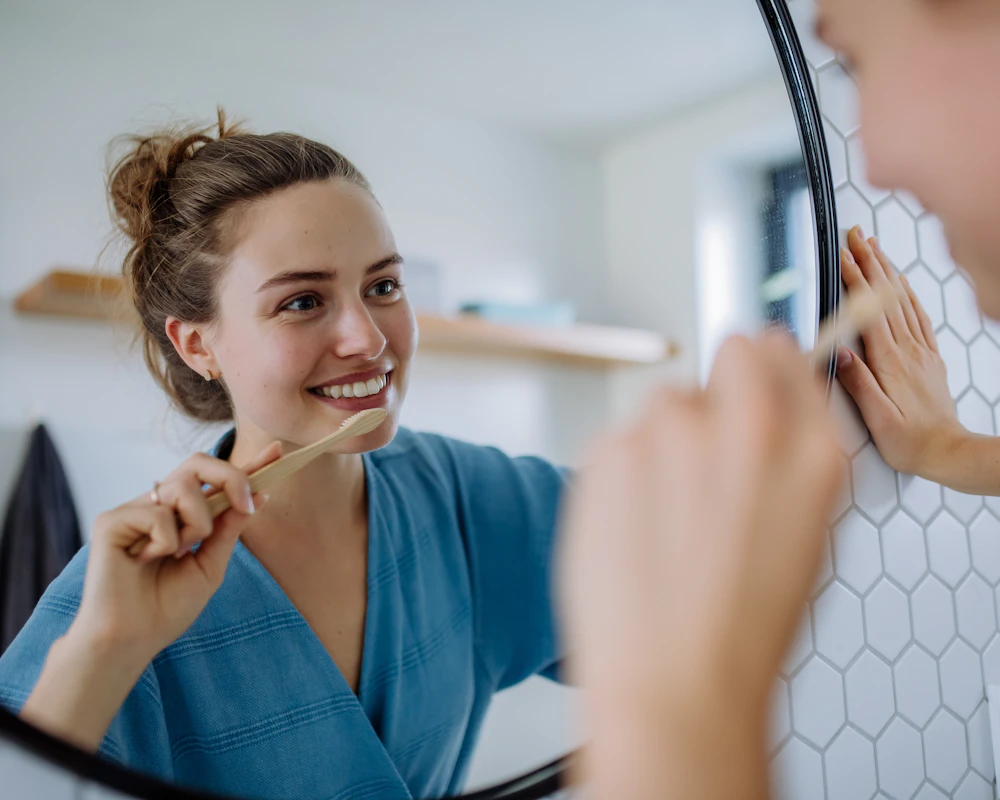 woman smiling in the mirror