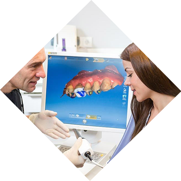 Dentist explaining CAD/CAM technology to patient