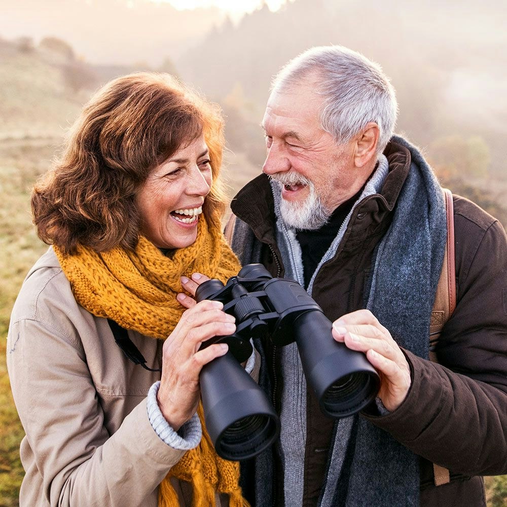 Mature man smiling at friend after glaucoma procedure