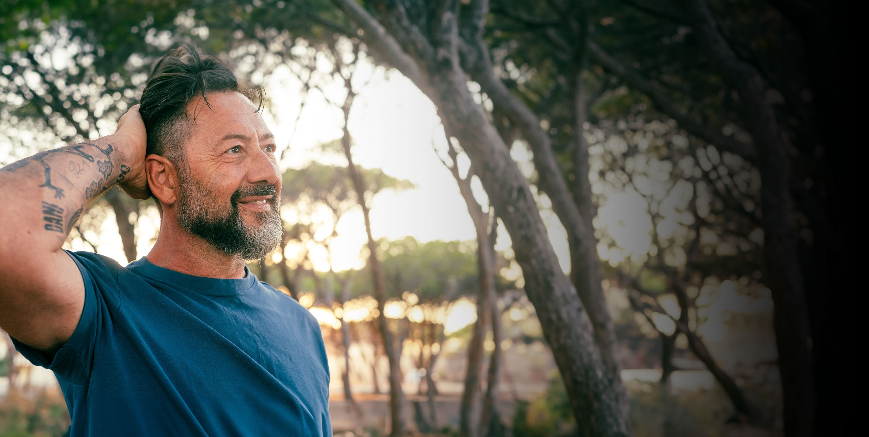 Couple holding binoculars smiling at each other