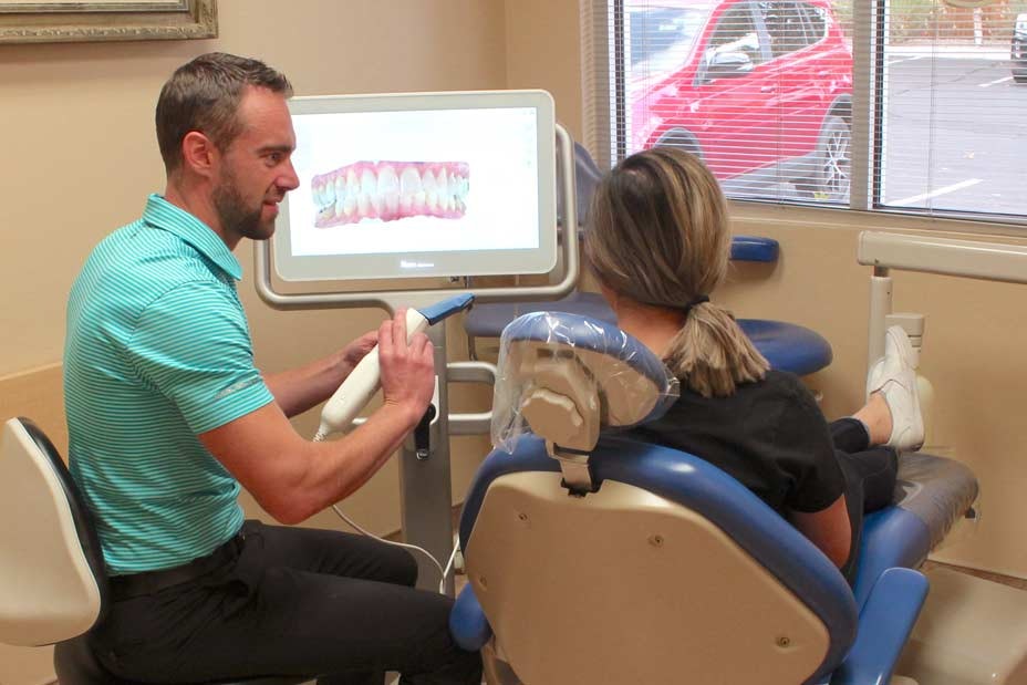 Dr. Ollason explains treatment to a patient