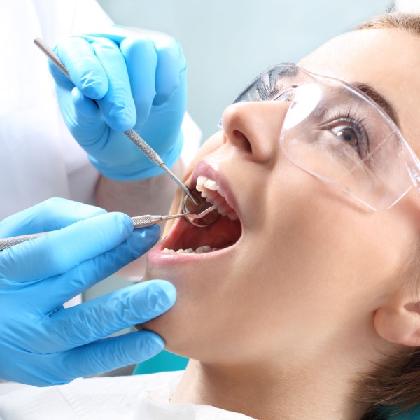 patient being examined by a dentist
