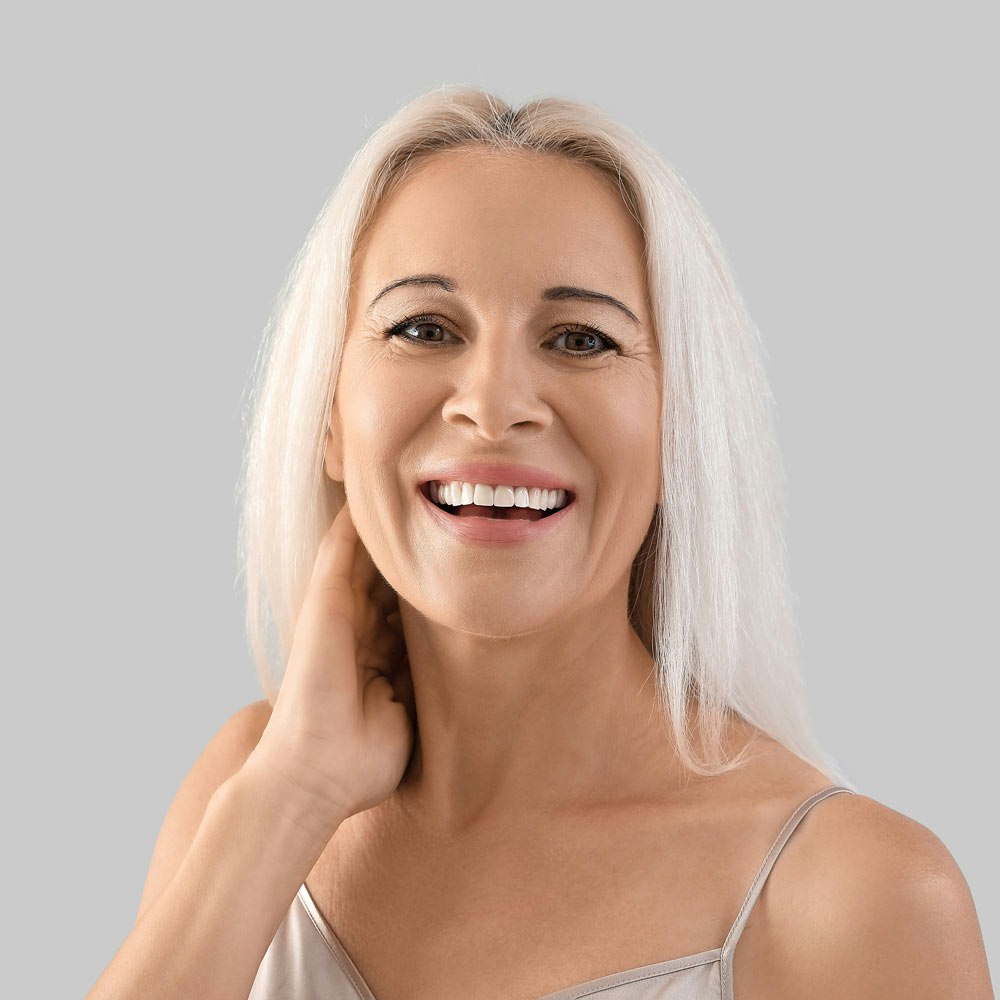 Smiling woman after cosmetic dentistry