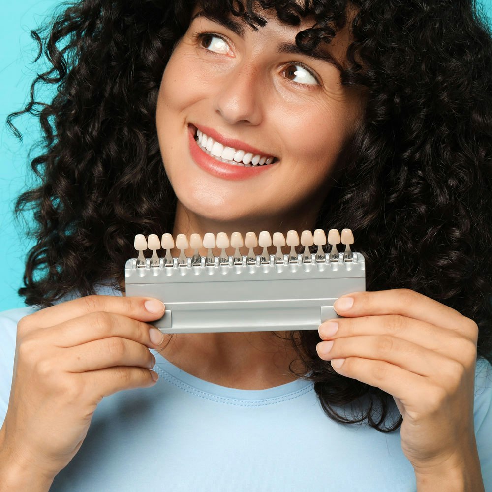 veneers shades being compared to man's teeth