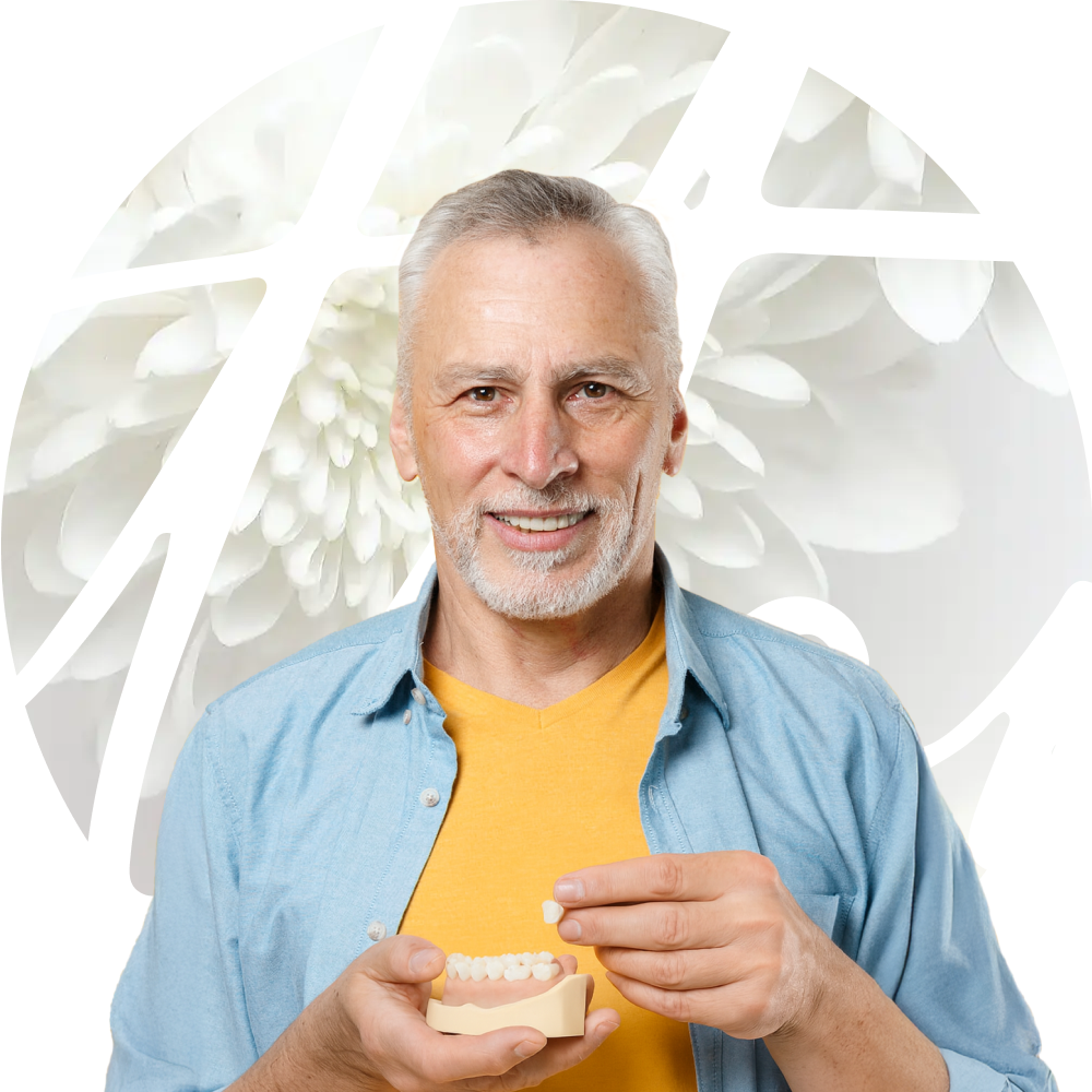 man holding dental crowns