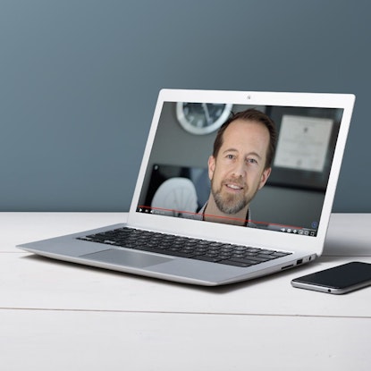 Dr. Jeffrey Dolgos on computer