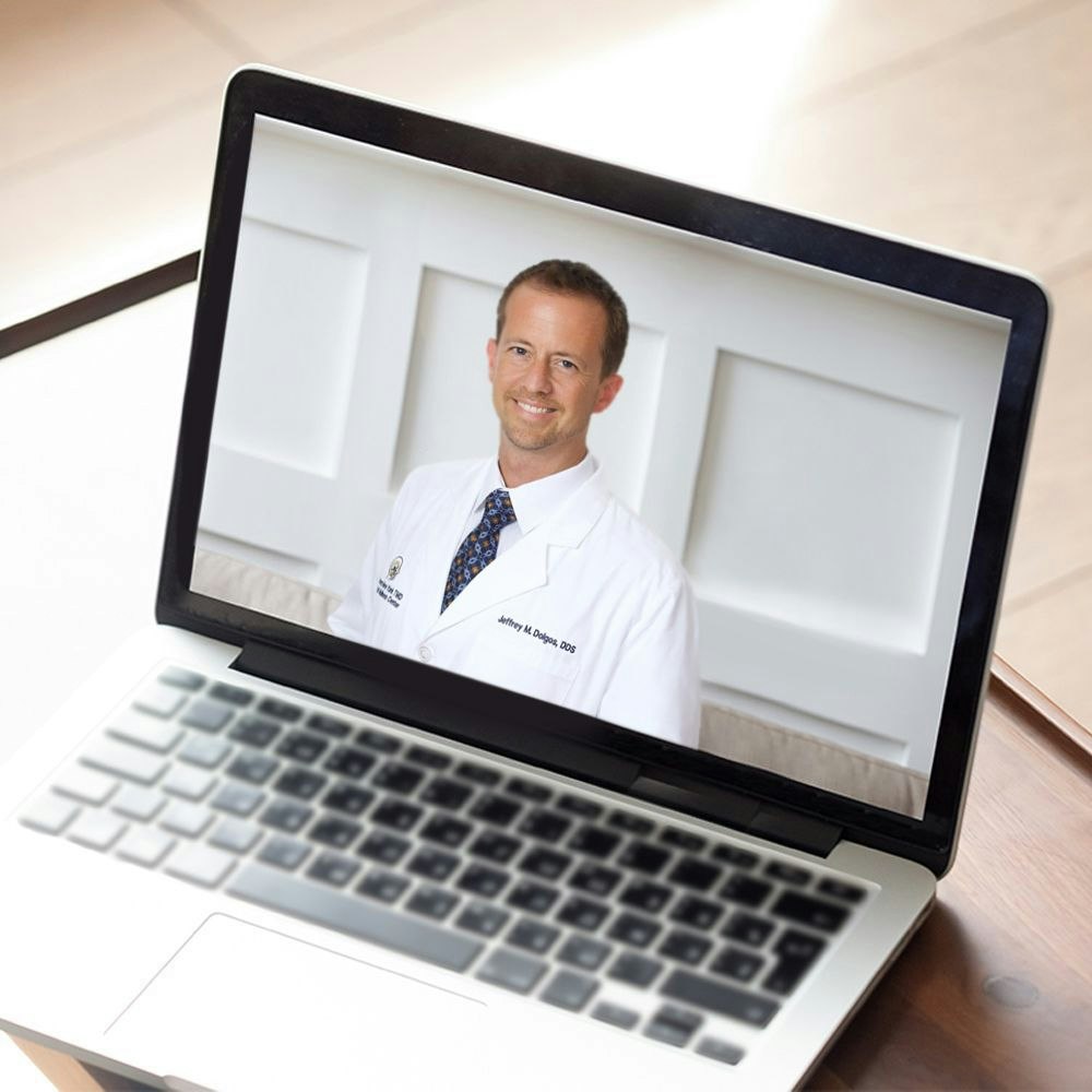 Dr. Dolgos on a computer