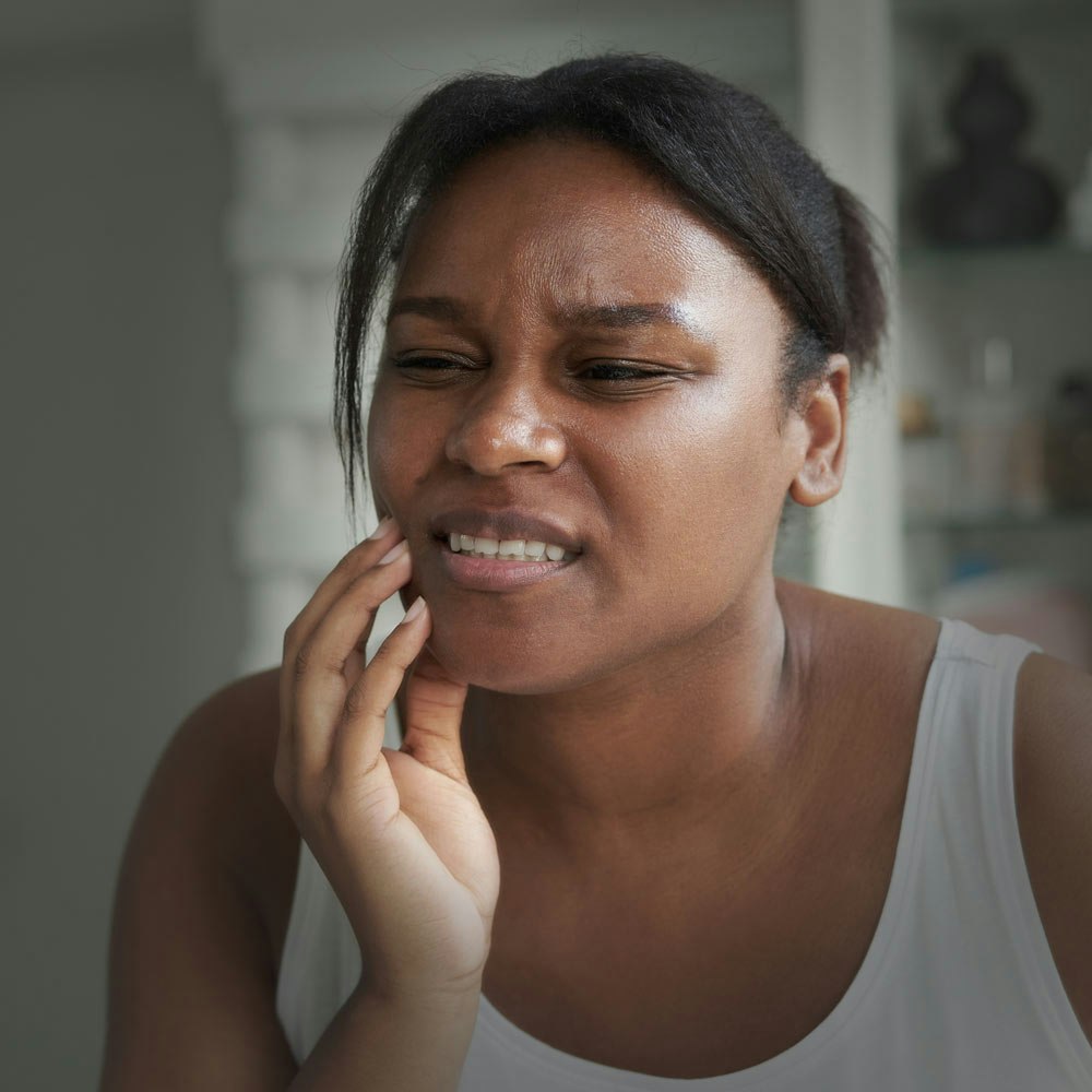Woman with TMJ pain