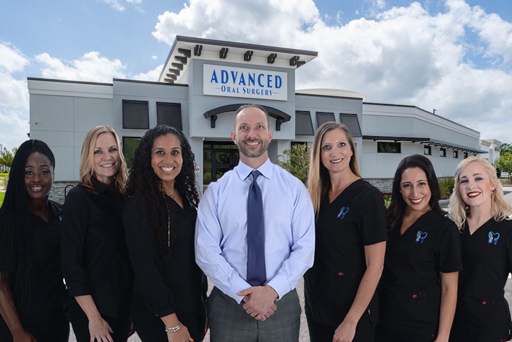 Photo of team in front of office