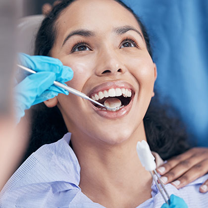 Woman getting a dental exam