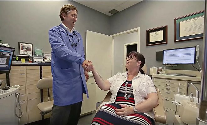 Dr. shaking patient's hand