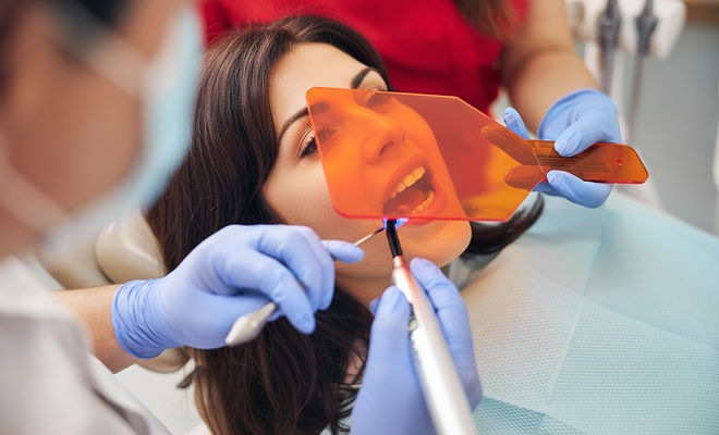 woman getting a dental bonding treatment
