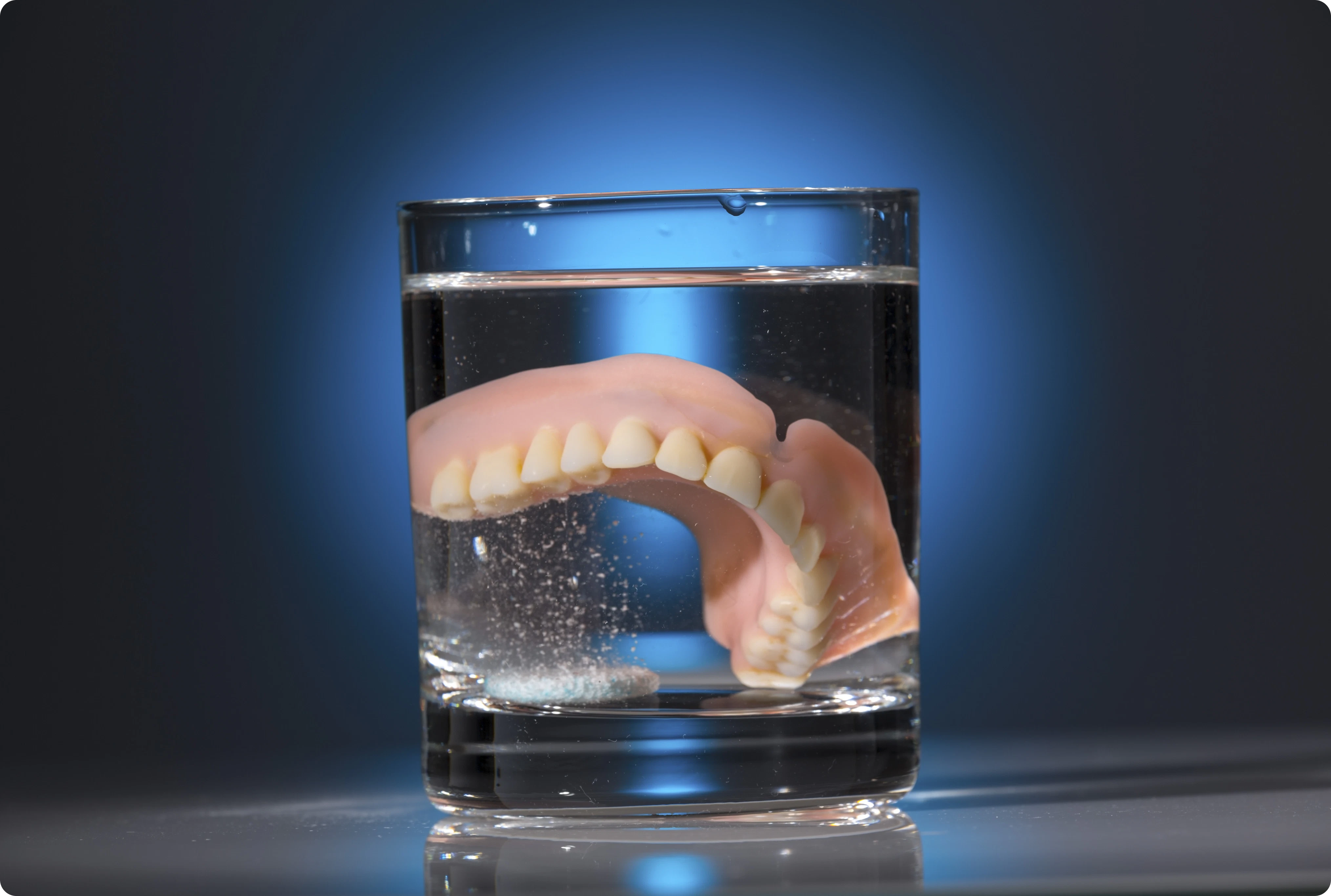 denture in glass of water