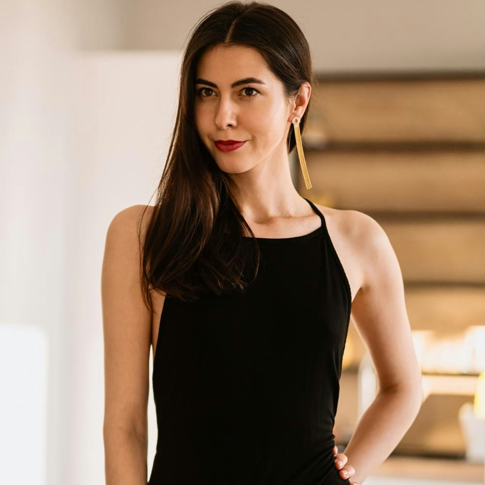 Woman confidently looking in the mirror