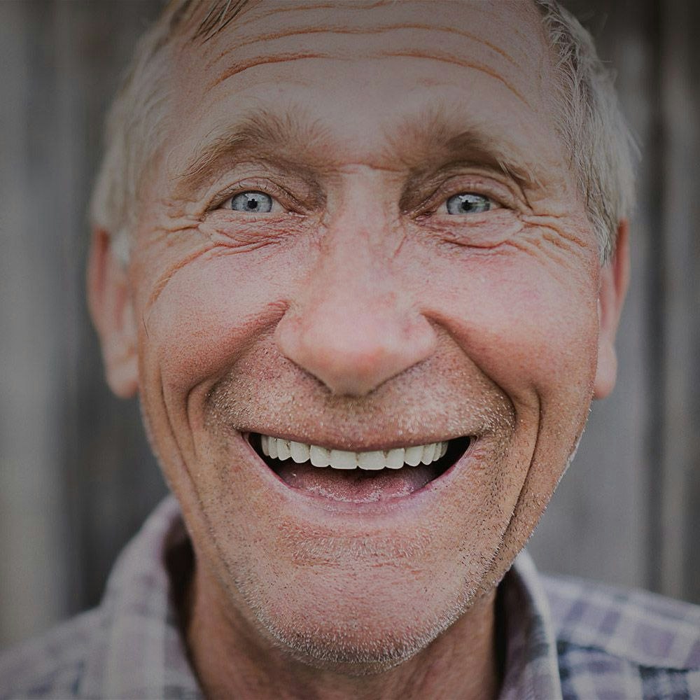 An old man smiling