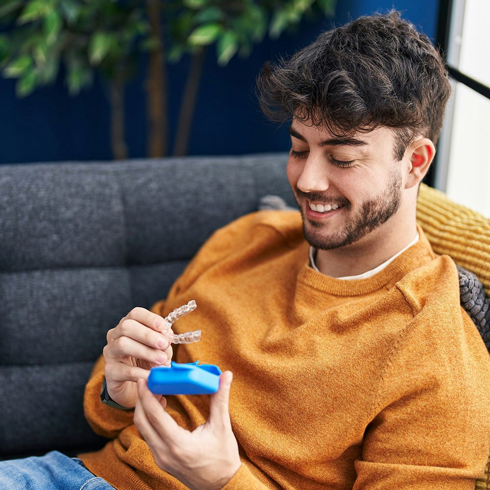 Young man with aligner