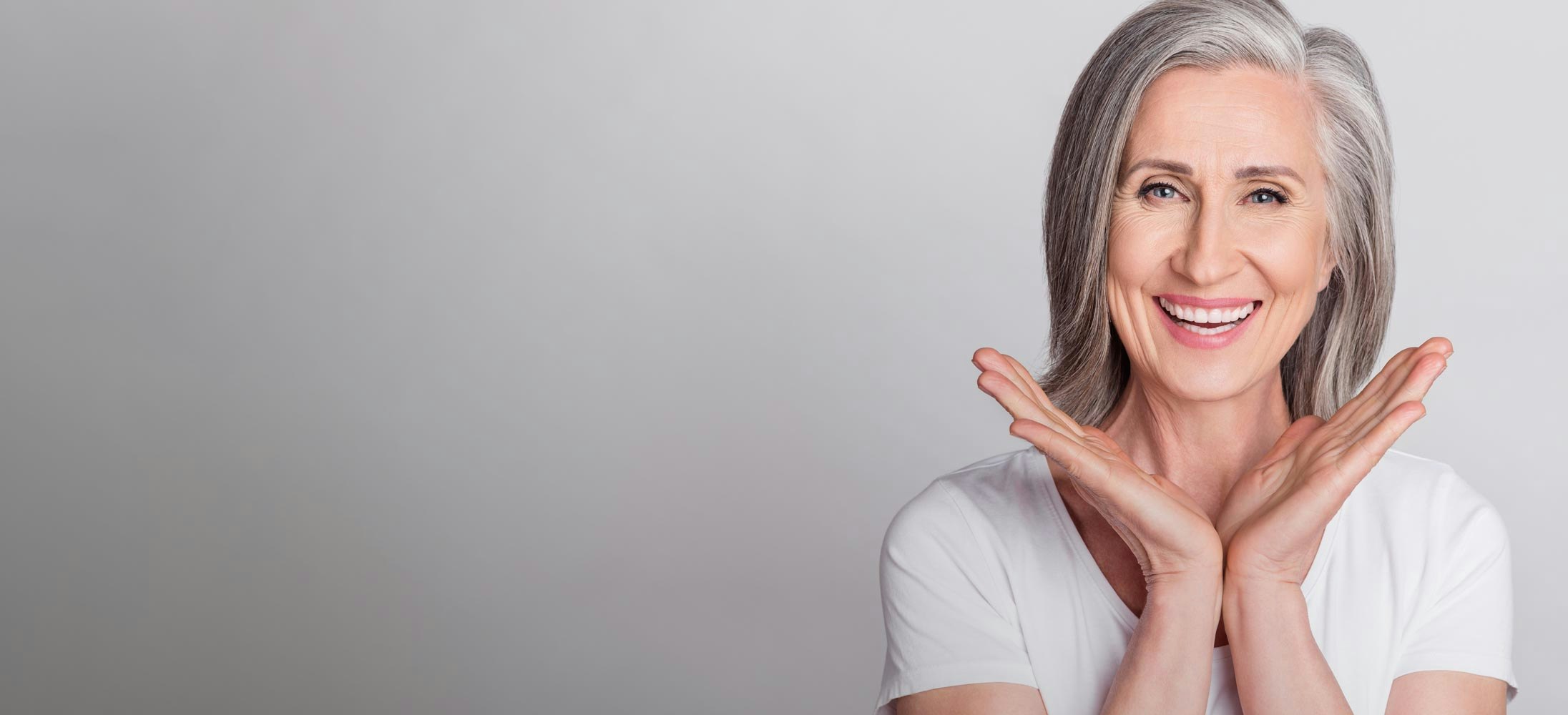 smiling woman with gray hair