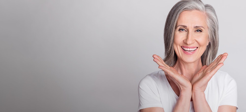 smiling woman with gray hair