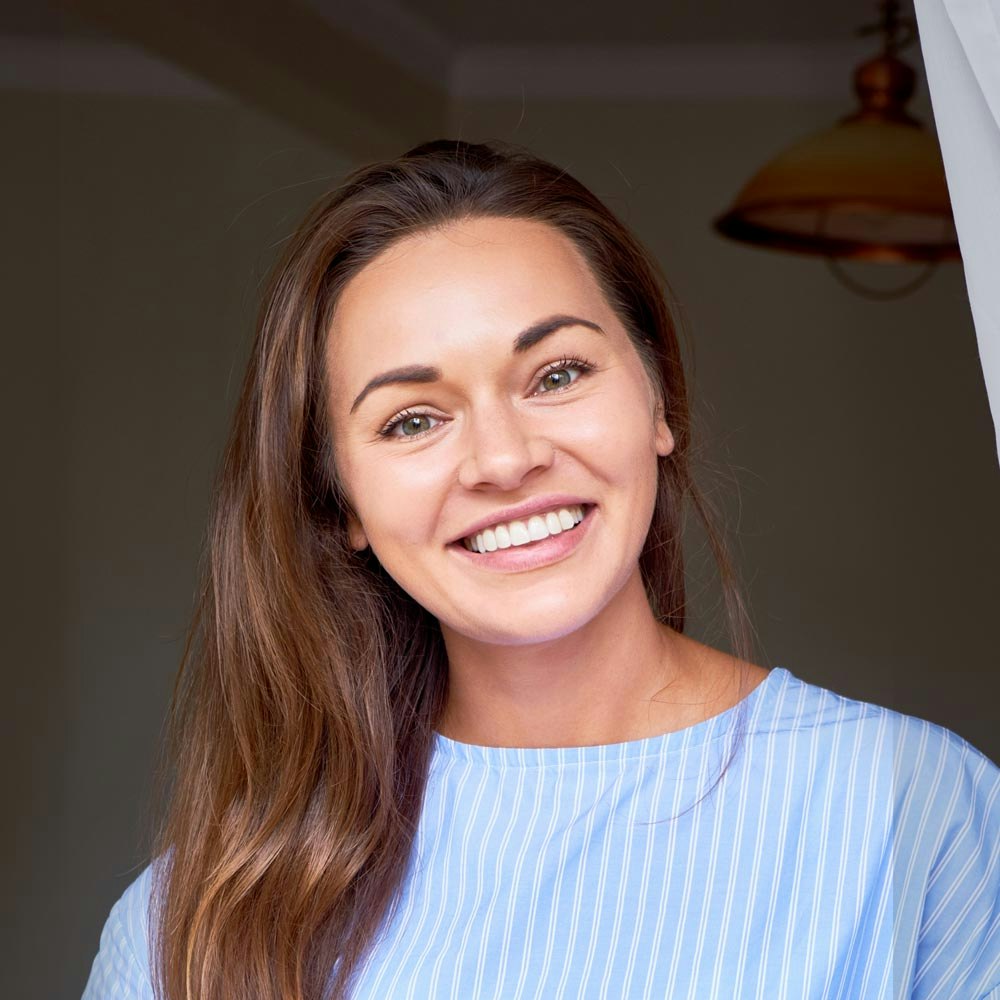 Smiling woman after cosmetic dentistry
