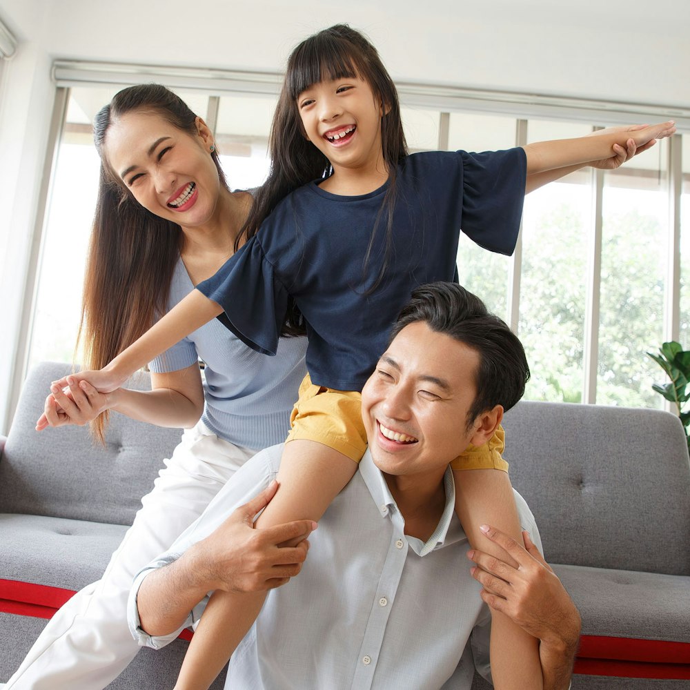 smiling parents with their daughter