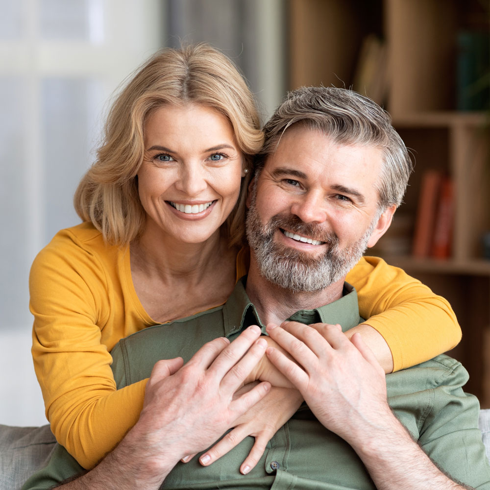 man and woman smiling