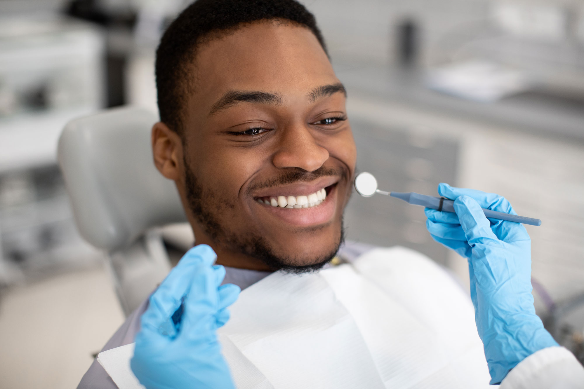 man smiling in the dental chair