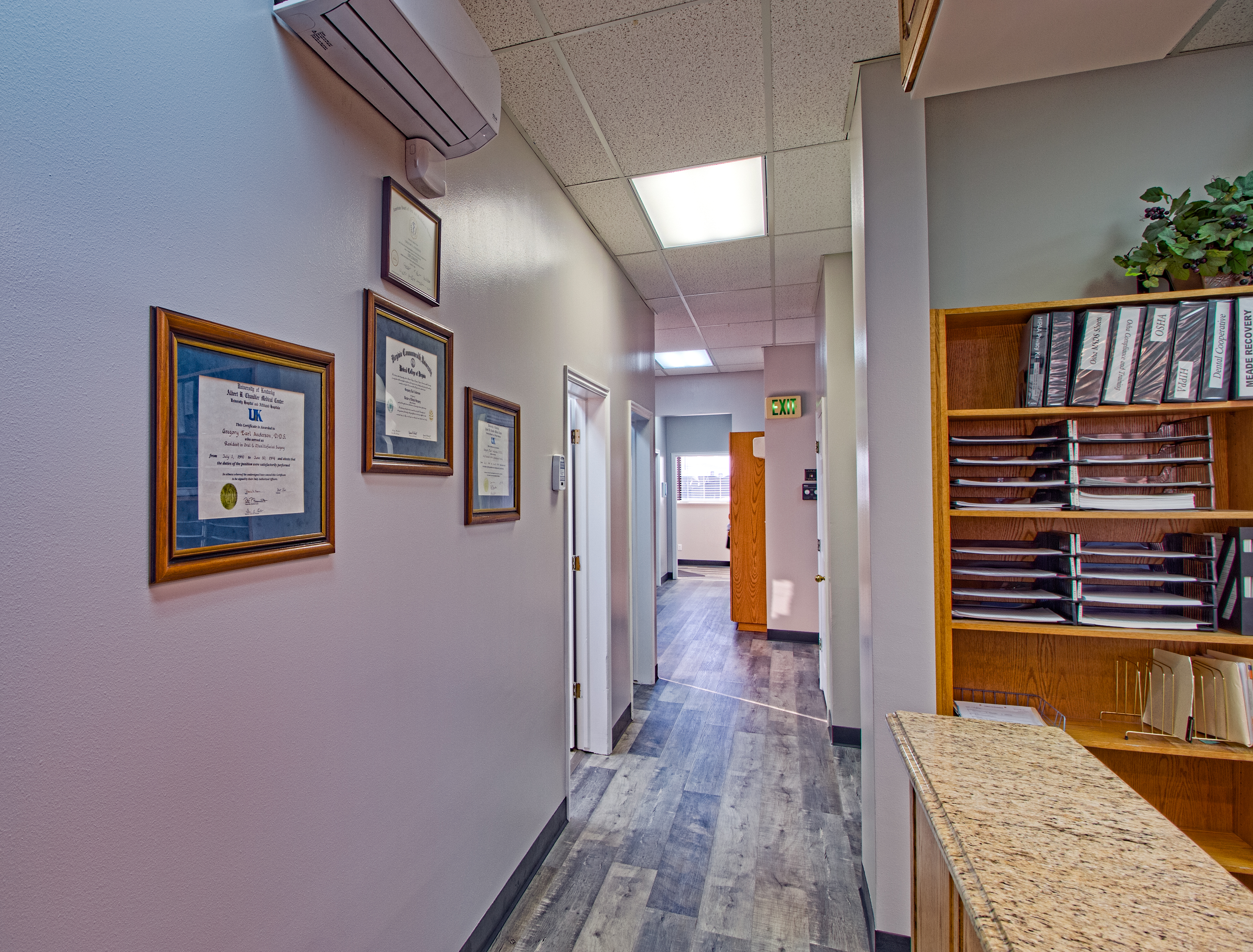 Certificates and diplomas on hall wall