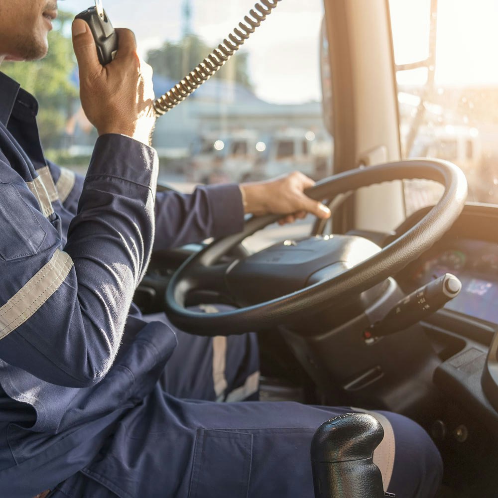 A man driving a truck