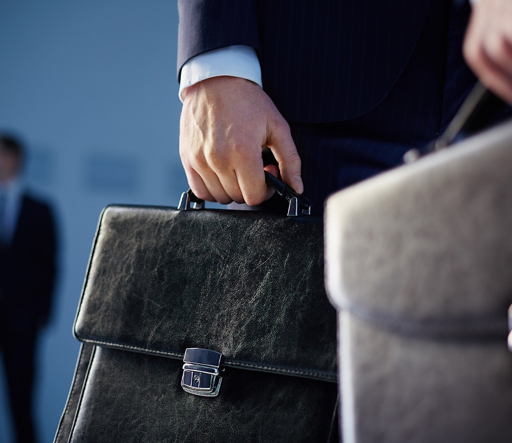 Personal injury attorney holding briefcase