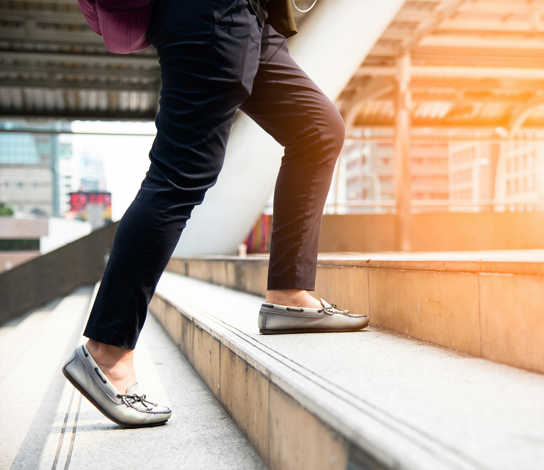 Woman walking up steps