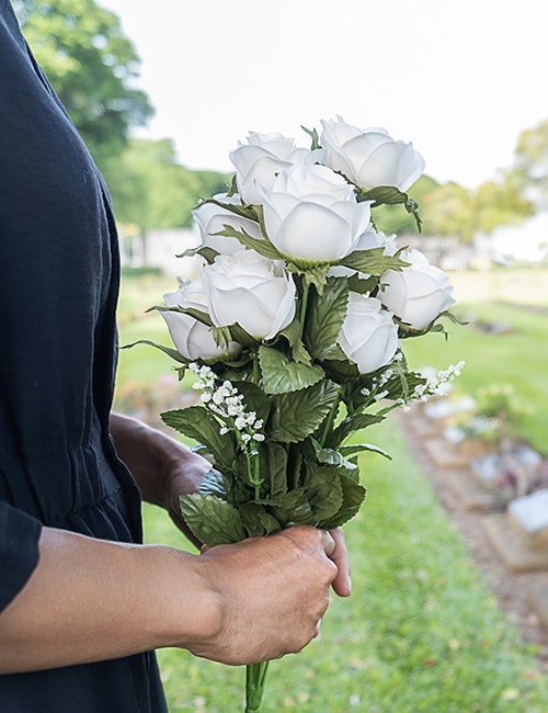 bouquet held at funeral after wrongful death