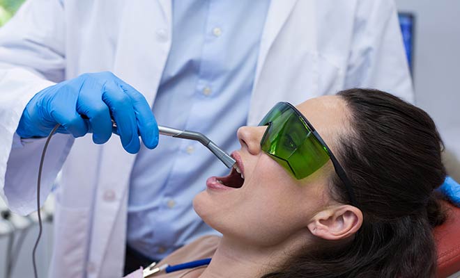 woman receiving laser therapy