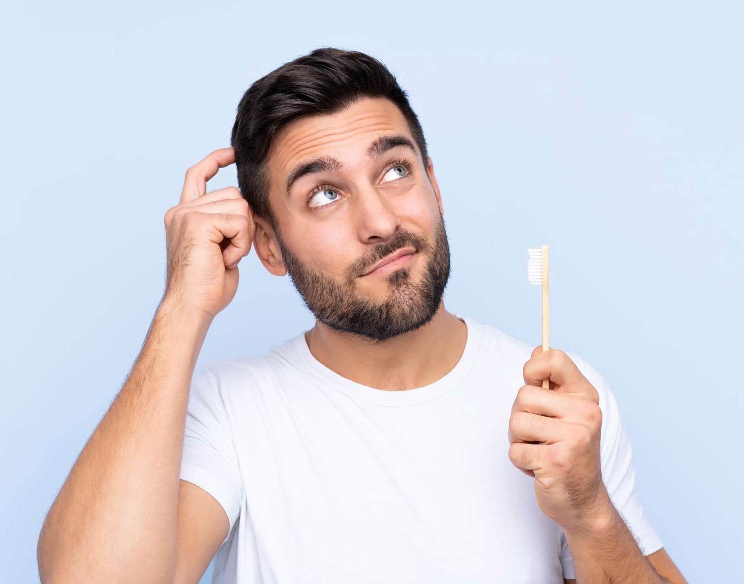 man holding toothbrush