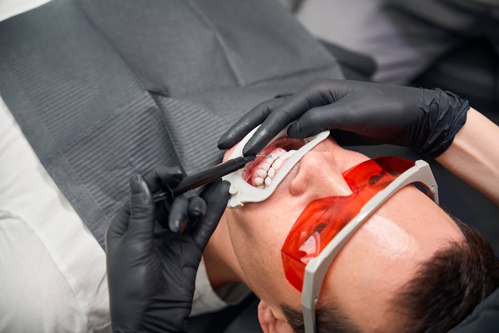man receiving teeth whitening
