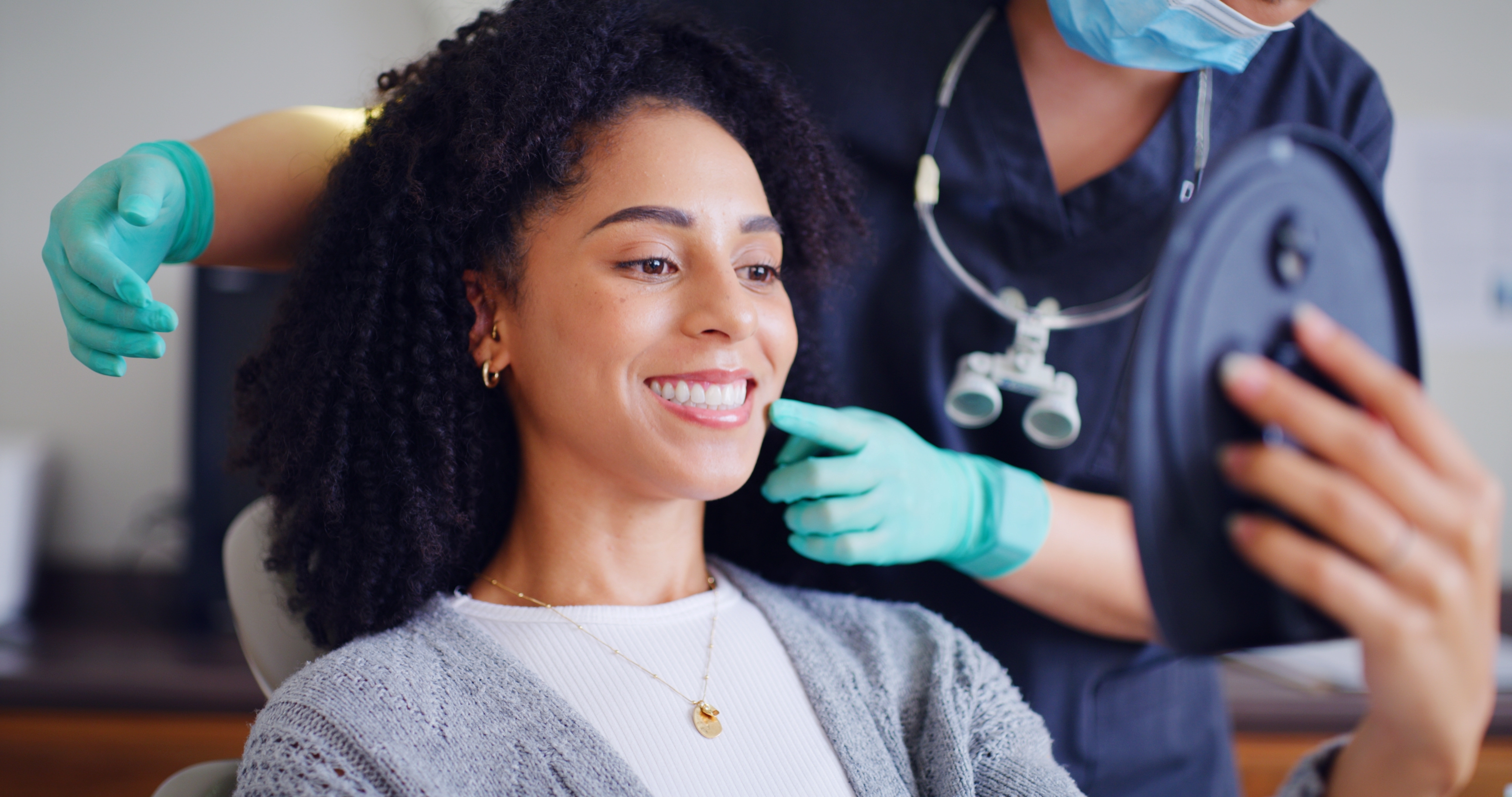 Smiling cosmetic dentistry patient in the exam chair