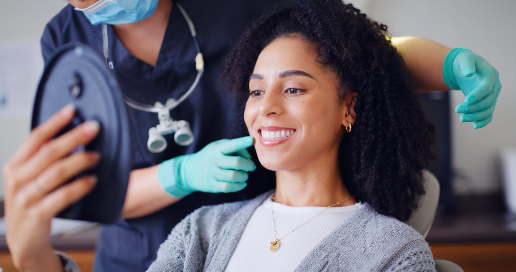 Smiling cosmetic dentistry patient in the exam chair