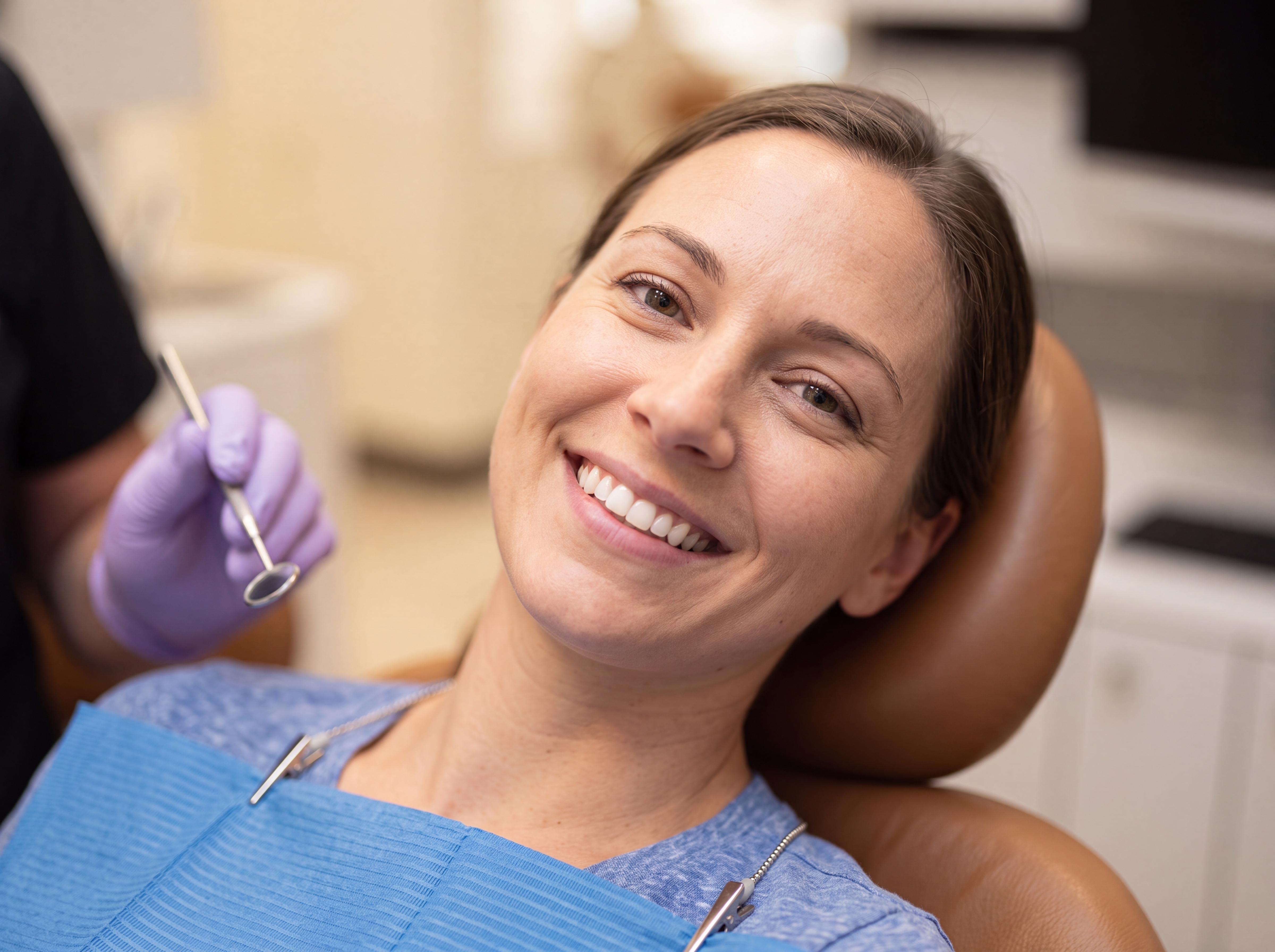 Smiling woman in the exam chair