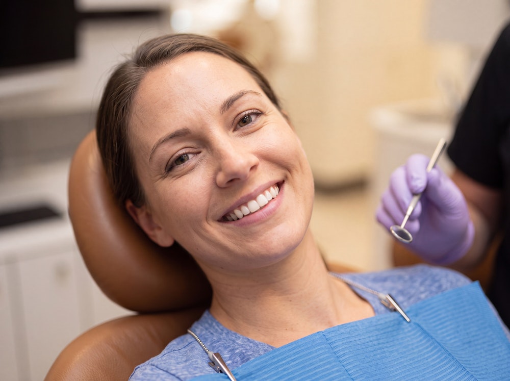 Smiling woman in the exam chair