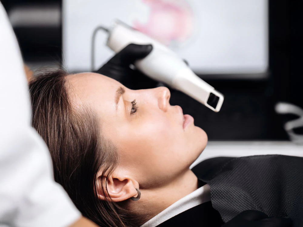 woman in dental chair with xray vest