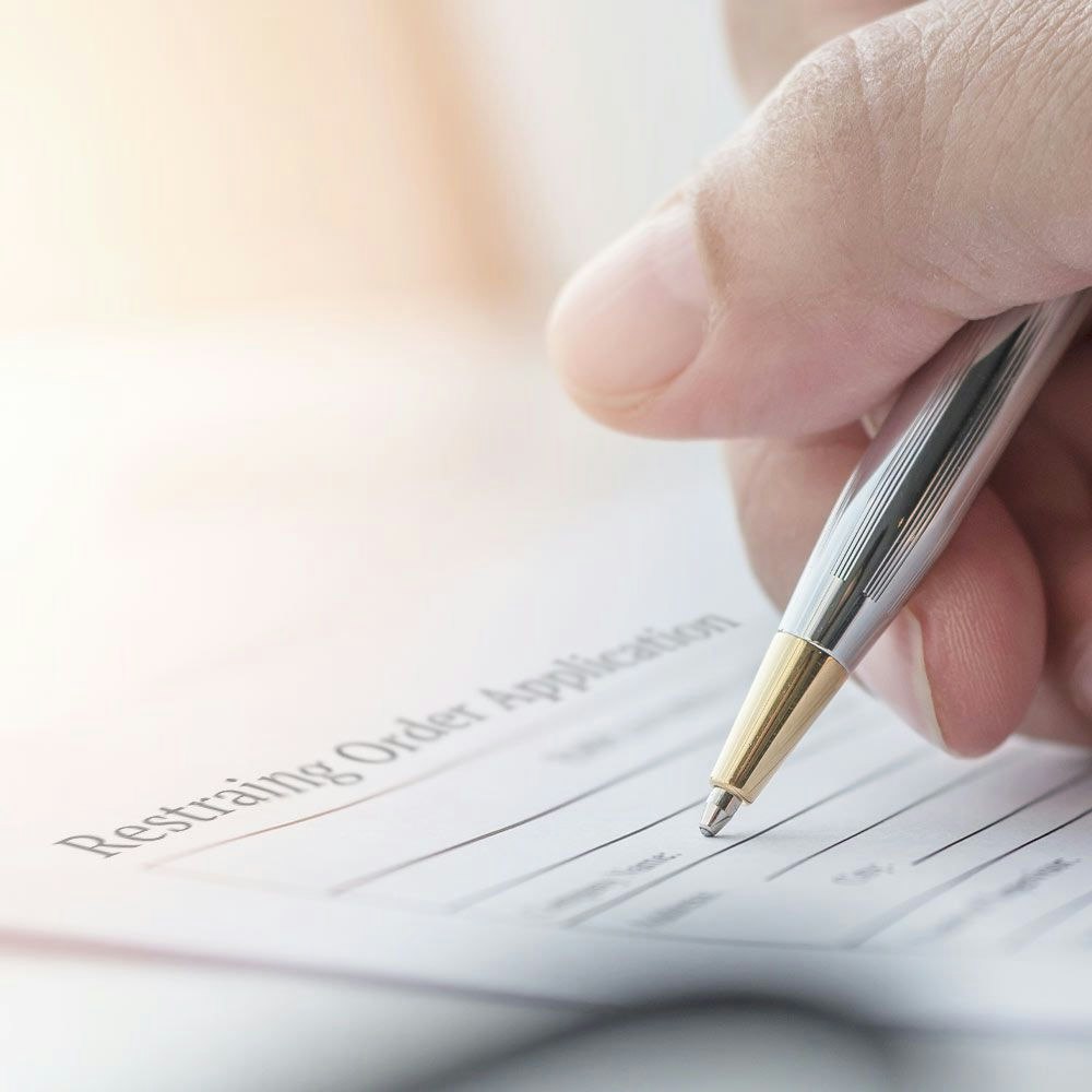 hand filling out paperwork