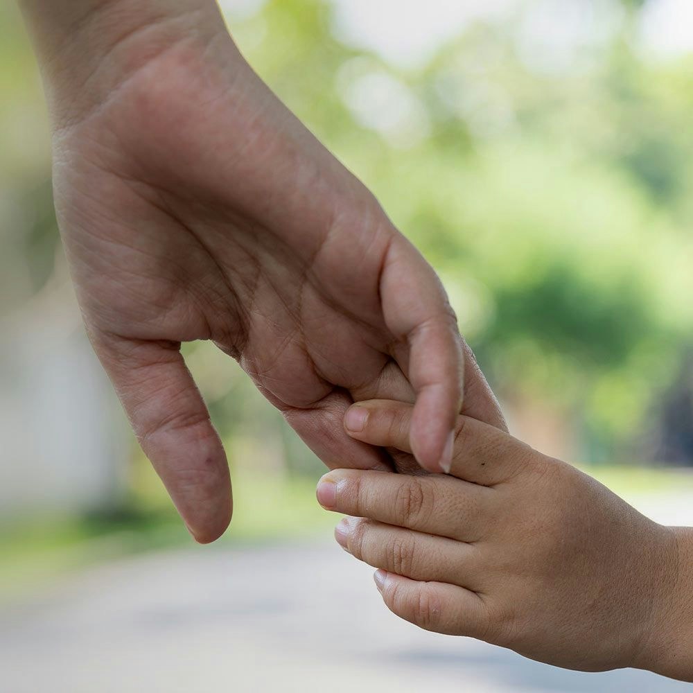 Child hand's in father's hand