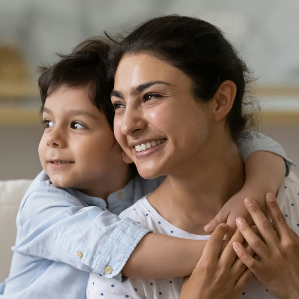 Mother and son hugging